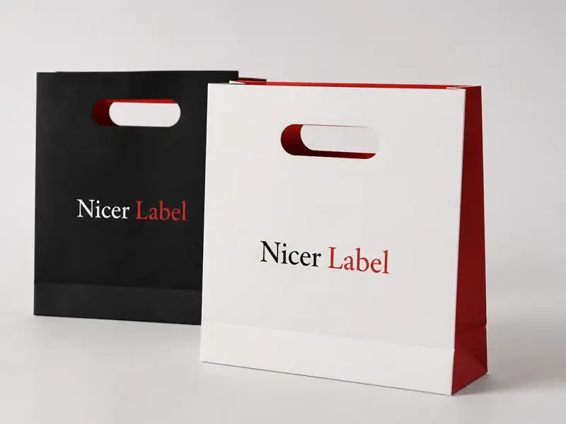 Custom die-cut handle paper bags by Nicer Label